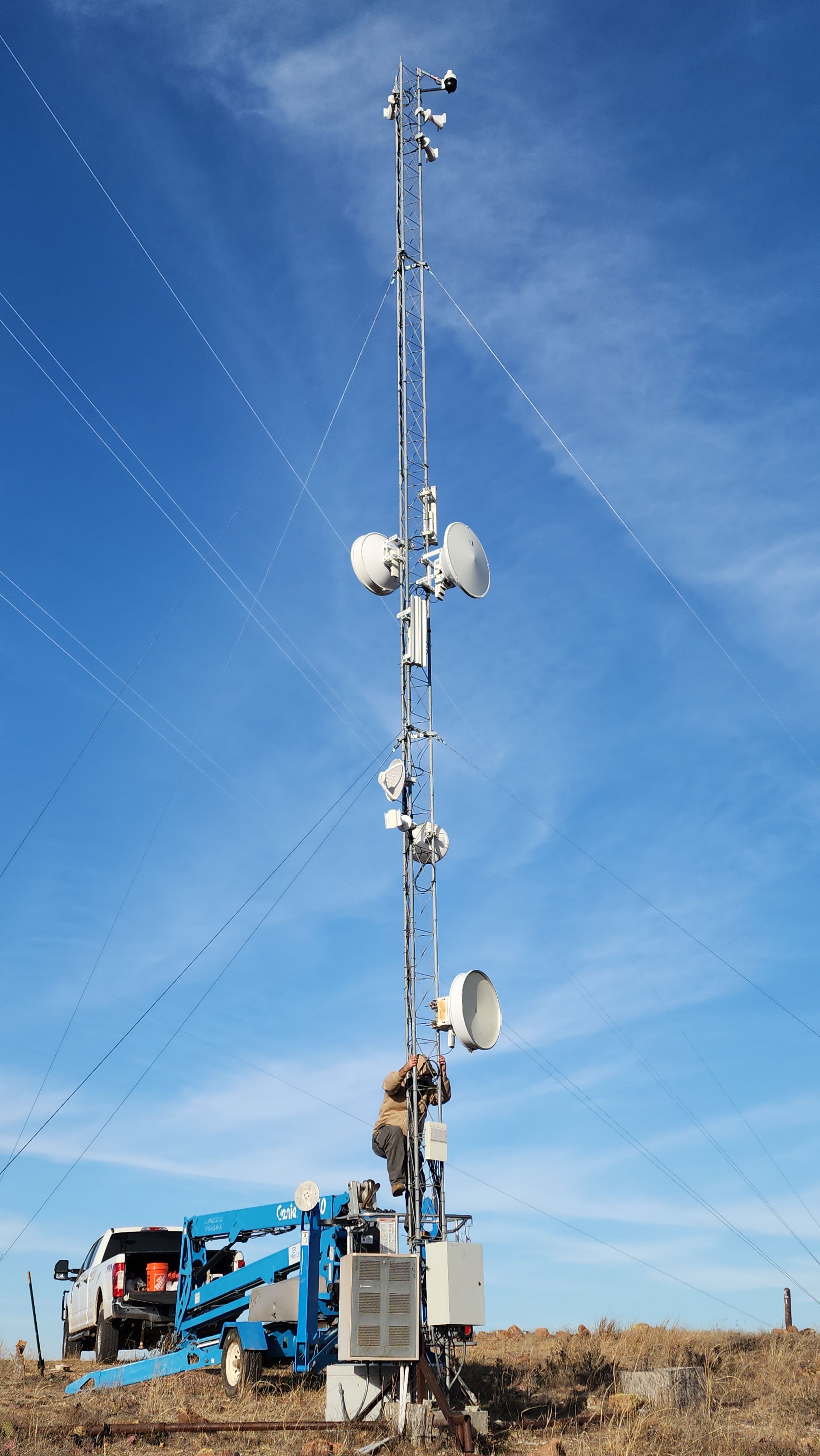 Technician working on tower infrastructure